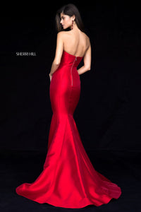 Sherri Hill 51671 - An elegant strapless mikado mermaid gown with a high slit, perfect for a sophisticated and timeless look.  The model is wearing the color red.