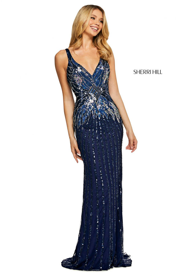 Woman wearing a blue sequin evening gown with 'Sherri Hill' branding on a white background