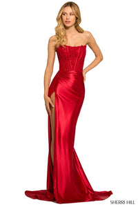 SHERRI HILL 55419 - A strapless satin gown with a lace corset top, high slit, and timeless elegance for a captivating entrance at prom.  The model is wearing the dress in the color red.