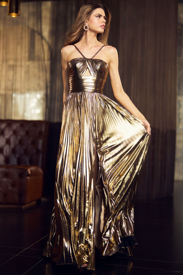 A stunning metallic pleated gown with a keyhole bodice, braided straps, and an empire waist. Perfect for making an entrance at prom night. Available at Madeline's Boutique in Toronto and Boca Raton.