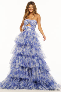 A mesmerizing floral tulle A-line evening gown by Sherri Hill, featuring a keyhole bodice and a ruffle skirt, perfect for elegant occasions.  Color of the dress is Ivory Blue..