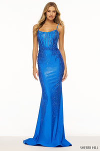 Sherri Hill 55988 Hot Fix Fitted Prom Gown - A captivating prom gown featuring a hot fix fitted silhouette, corset bodice, lace embellished sides, and a lace-up back for a glamorous and sophisticated look.  This is the dress in the color royal.