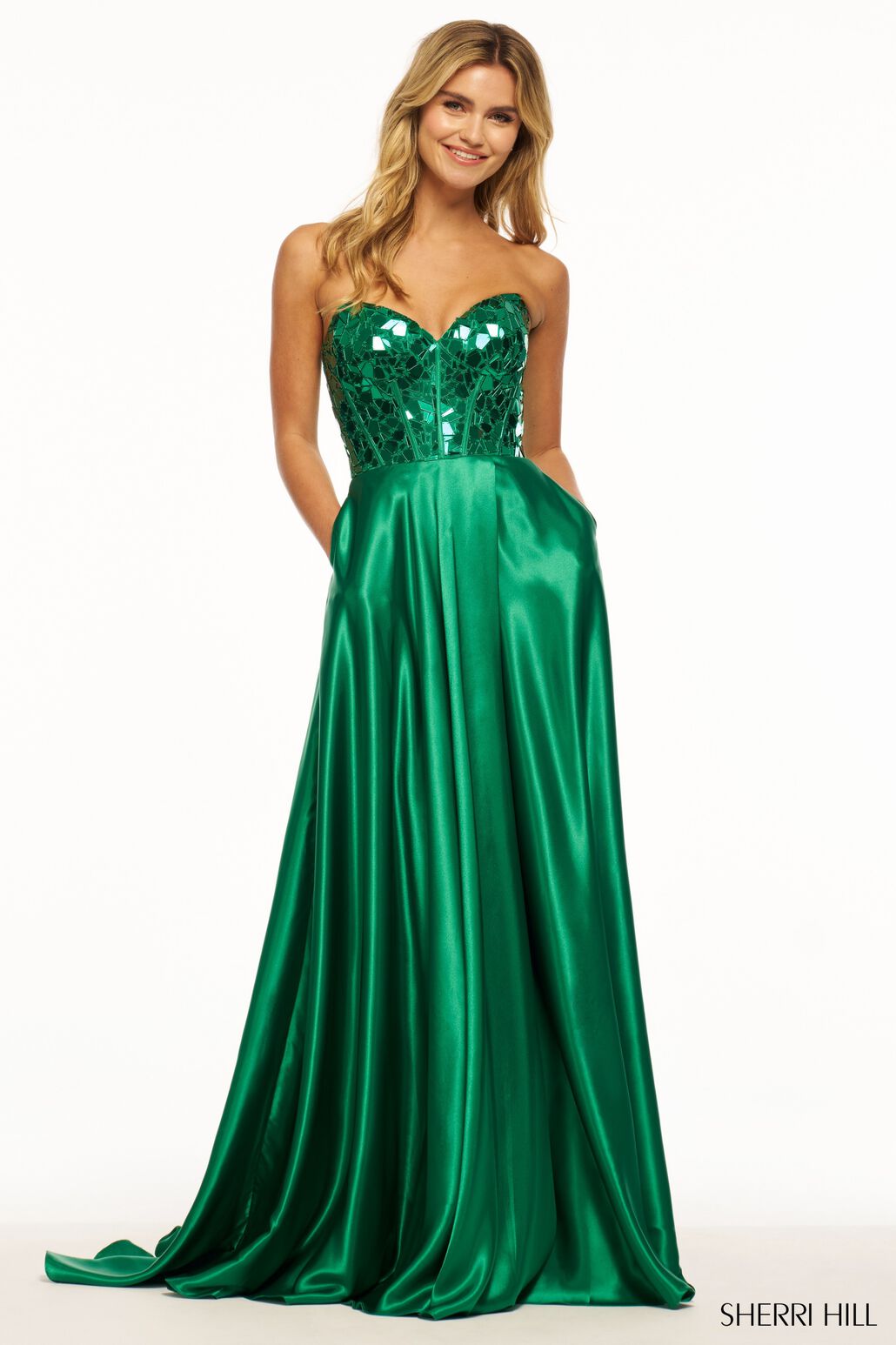 Sherri Hill 56041 Strapless Charmeuse Gown with Cut Glass Corset Bodice - A stunning strapless gown featuring a cut glass corset bodice, sweetheart neckline, and high skirt slit. Perfect for making a statement at prom.  The model is wearing the dress in the color emerald.
