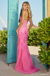 Sherri Hill 56077 Chic Halter Leaf Lace Prom Gown - A stylish and sophisticated halter gown featuring intricate leaf lace, a corset bodice, and a high slit for a glamorous and fashionable prom look.  The model is wearing the dress in bright pink.