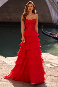 Model wearing Sherri Hill 57336 strapless gown with leaf lace corset bodice and layered chiffon ruffle skirt with slit.