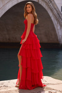 Model wearing Sherri Hill 57336 strapless gown with leaf lace corset bodice and layered chiffon ruffle skirt with slit.