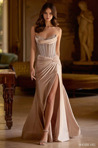 Model wearing Sherri Hill 57473 strapless fitted gown with sparkling hot fix corset and high-slit skirt