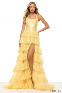 Yellow ruffled dress with a slit on a white background, featuring the Sherri Hill brand.