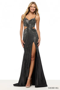 Woman wearing a black beaded evening gown with a high slit on a white background, brand 'Sherri Hill' visible.