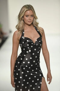 Model wearing the Sherri Hill 57802 halter neckline fitted gown with a high slit.