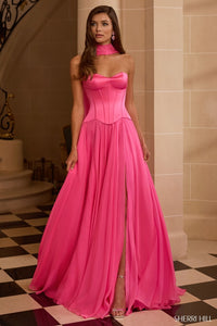 Woman wearing a pink evening gown in an elegant interior setting
