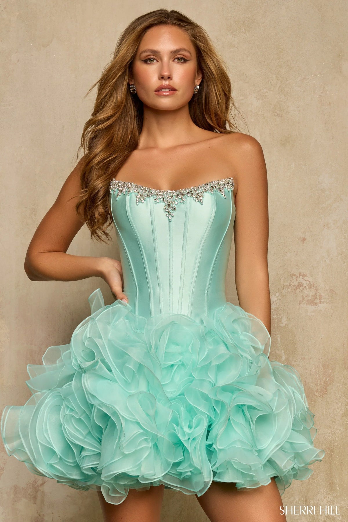 Light  green strapless dress with ruffled skirt on a neutral background