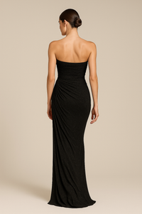 Black strapless gown on a beige background