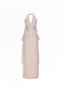 Tarik Ediz 98819 halter plunge neckline column gown with tiered skirt detailing, open back, floral accent, and long sash.