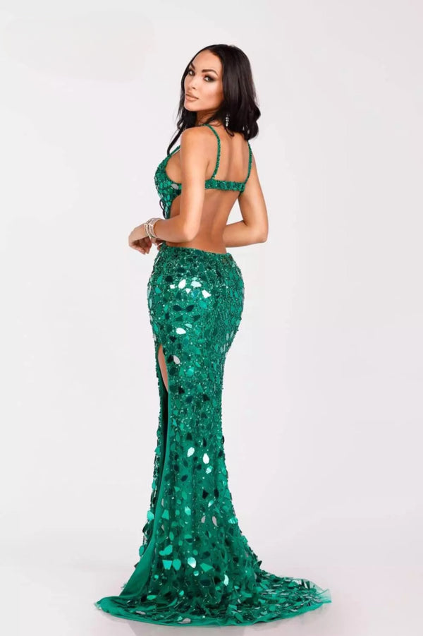 Shine brightly in Terani Couture's mirror-embellished dress, featuring a high slit and sweetheart neckline. Perfect for red carpet events and prom. Available at Madeline's Boutique in Toronto and Boca Raton, Florida.  Model wearing dress in Emerald.