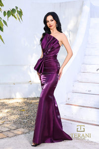 Model wearing Terani 252E5513 one-shoulder shimmer organza evening gown with peplum waist accent and fitted flared silhouette.  Color Plum.