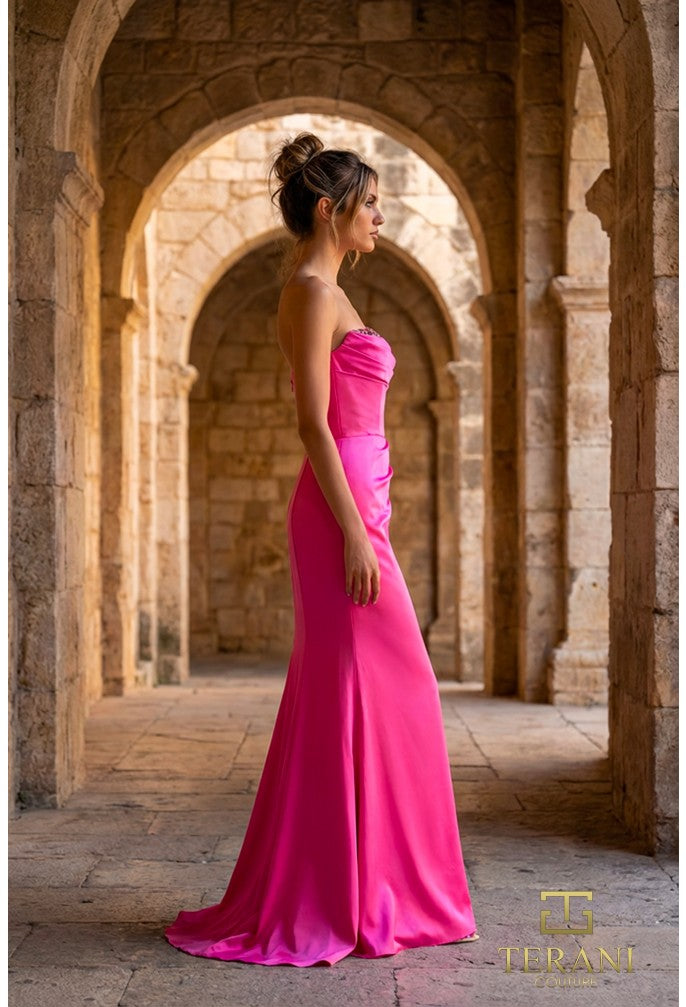 Woman in a magenta dress standing in stone archways