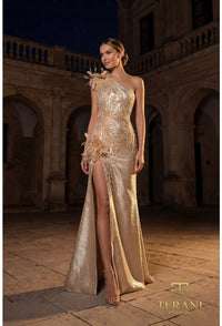 Model wearing Terani 262E7062 one-shoulder evening gown with embellished appliqués, floral accents, high slit, and a fitted floor-length silhouette.