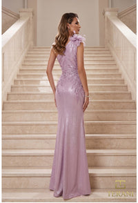 Woman in a lavender evening gown standing on a staircase