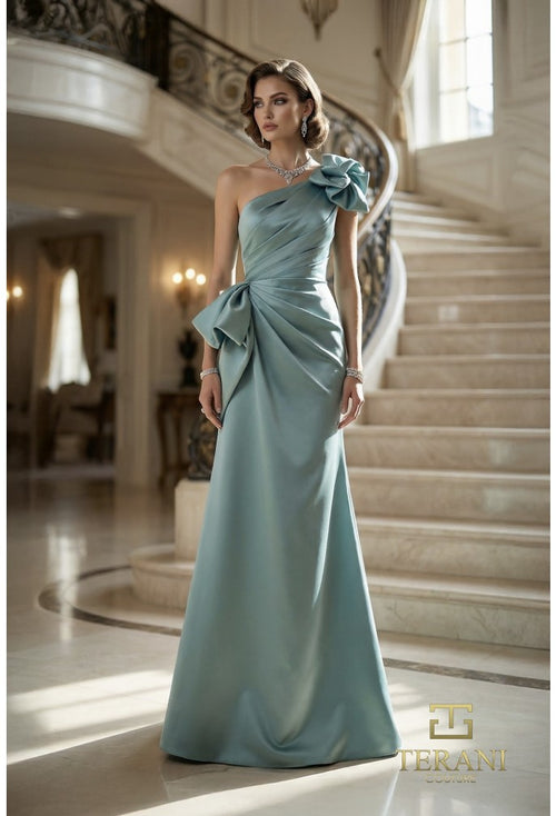 Model wearing Terani 262E7132 one-shoulder mermaid gown with draped bodice, statement bow accents, fitted silhouette, and sweep train.