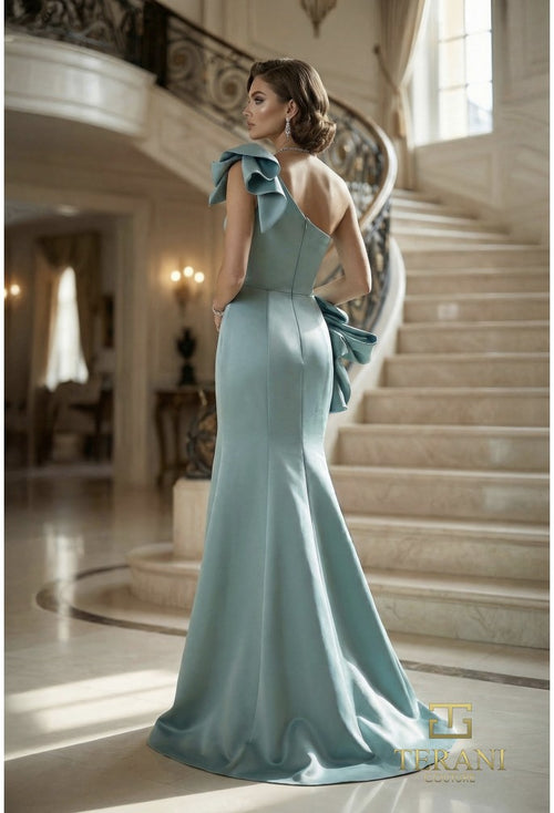 Model wearing Terani 262E7132 one-shoulder mermaid gown with draped bodice, statement bow accents, fitted silhouette, and sweep train.
