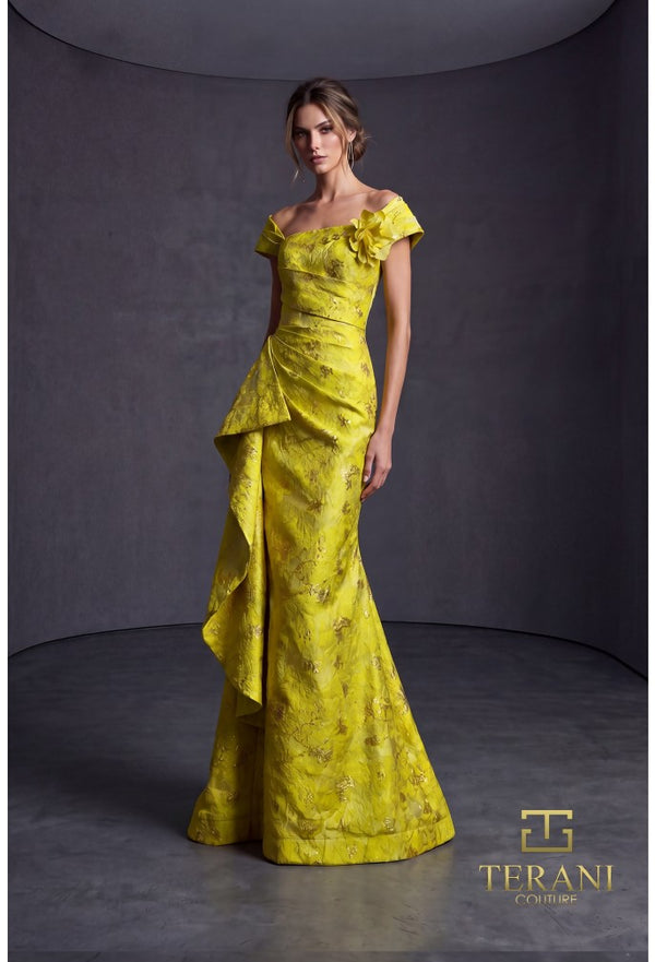 Woman wearing a lemon yellow evening gown with floral details against a gray background, Terani Couture branding visible.