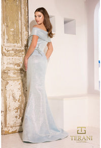 Model wearing Terani Couture 241M2771 off-the-shoulder beaded trumpet gown with fitted bodice and elegant flared skirt in light blue back view.