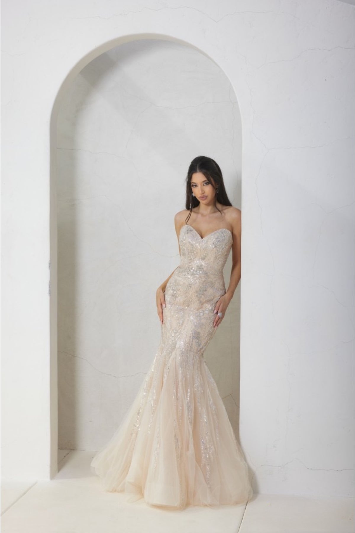 Terani Couture 241P2219 Sleeveless Beaded Trumpet Evening Gown - A sophisticated evening gown with a sleeveless trumpet silhouette, beaded detailing on tulle, a sweetheart neckline, and a long dress for a timeless and glamorous look. This is a picture of the dress in Champagne.