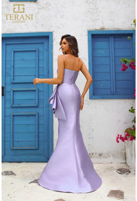 Model wearing Terani Couture 251E4265 off-shoulder pleated gown with fitted silhouette and high slit, perfect for gala, red carpet, or formal evening event.