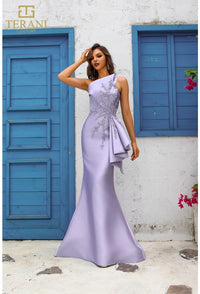 Model wearing Terani Couture 251E4265 off-shoulder pleated gown with fitted silhouette and high slit, perfect for gala, red carpet, or formal evening event.