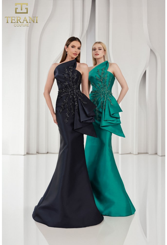 Model wearing Terani Couture 251E4265 off-shoulder pleated gown with fitted silhouette and high slit, perfect for gala, red carpet, or formal evening event.