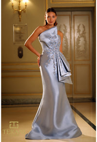 Model wearing Terani Couture 251E4265 off-shoulder pleated gown with fitted silhouette and high slit, perfect for gala, red carpet, or formal evening event.