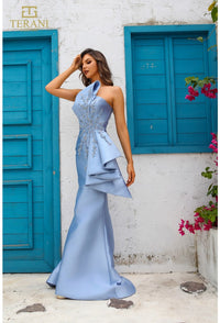 Model wearing Terani Couture 251E4265 off-shoulder pleated gown with fitted silhouette and high slit, perfect for gala, red carpet, or formal evening event.