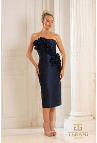 Model wearing Terani Couture 252C5042 strapless bodycon dress with 3D floral appliqués, fitted silhouette, and midi length.