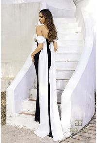 Model wearing Terani Couture 252E5532 off-shoulder gown with 3D floral appliqué and draped back panels, perfect for formal evenings and Mother of the Bride or Groom.