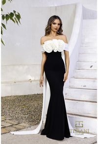 Model wearing Terani Couture 252E5532 off-shoulder gown with 3D floral appliqué and draped back panels, perfect for formal evenings and Mother of the Bride or Groom.