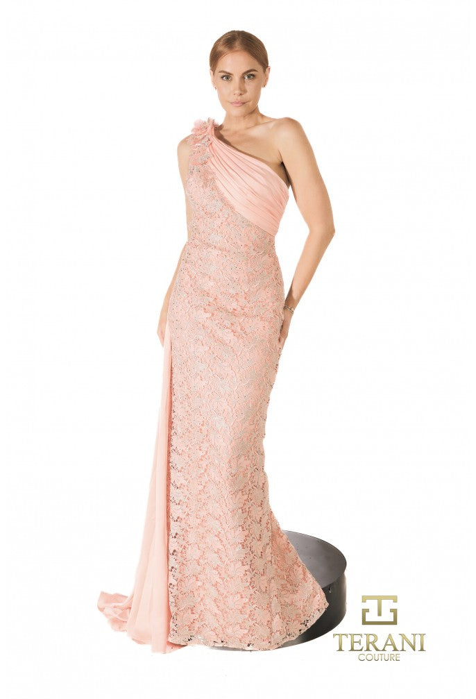 Woman wearing a pink one-shoulder gown with lace details on a white background, featuring the Terani brand.