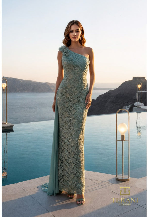 Woman in a light green one-shoulder dress standing by a pool with a scenic background