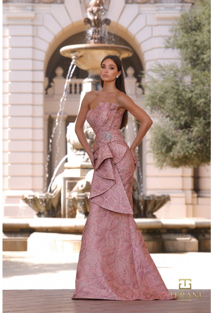 Model wearing Terani Couture 261E6269 strapless sculpted evening gown with structured bodice and draped skirt details.