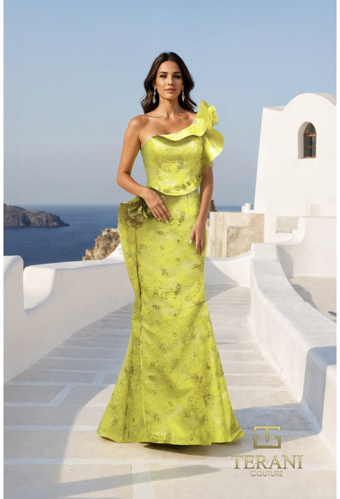 Woman in a yellow evening gown standing on a Mediterranean-style staircase with ocean view.