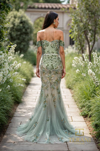 Model wearing Terani Couture 261P6676 off-shoulder mermaid gown with sweetheart neckline and intricate embellishment.