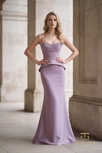 Model wearing Terani Couture 262E7099 mermaid evening gown with an embellished square neckline, shoulder straps, peplum waist, back slit, and sweep train.