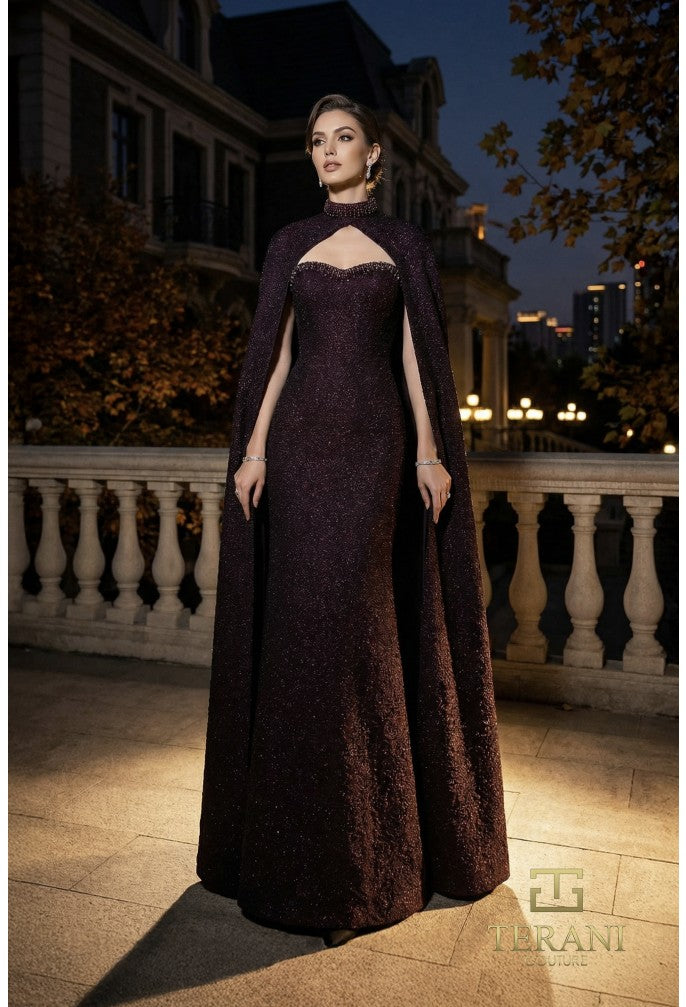 Model wearing Terani Couture 262E7125 fitted evening gown with high-neck cape sleeves, sweetheart bodice, open back, and floor-length silhouette.