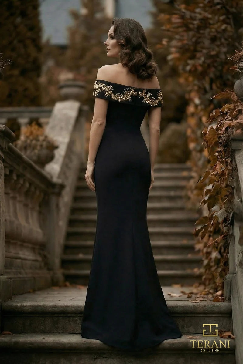 Terani Couture 262E7139 off-the-shoulder gown with embellished neckline, fitted sheath silhouette and gently flared floor-length skirt.  Back View