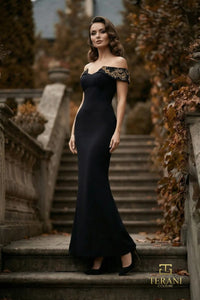 Terani Couture 262E7139 off-the-shoulder gown with embellished neckline, fitted sheath silhouette and gently flared floor-length skirt.