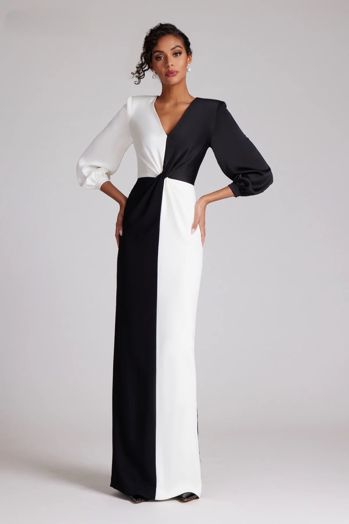 Teri Jon Style 237038 - A classic straight floor-length gown with long sleeves, v-neckline, and twist draping at the waist, perfect for the Mother of the Bride, Mother of the Groom, or formal black-tie galas.