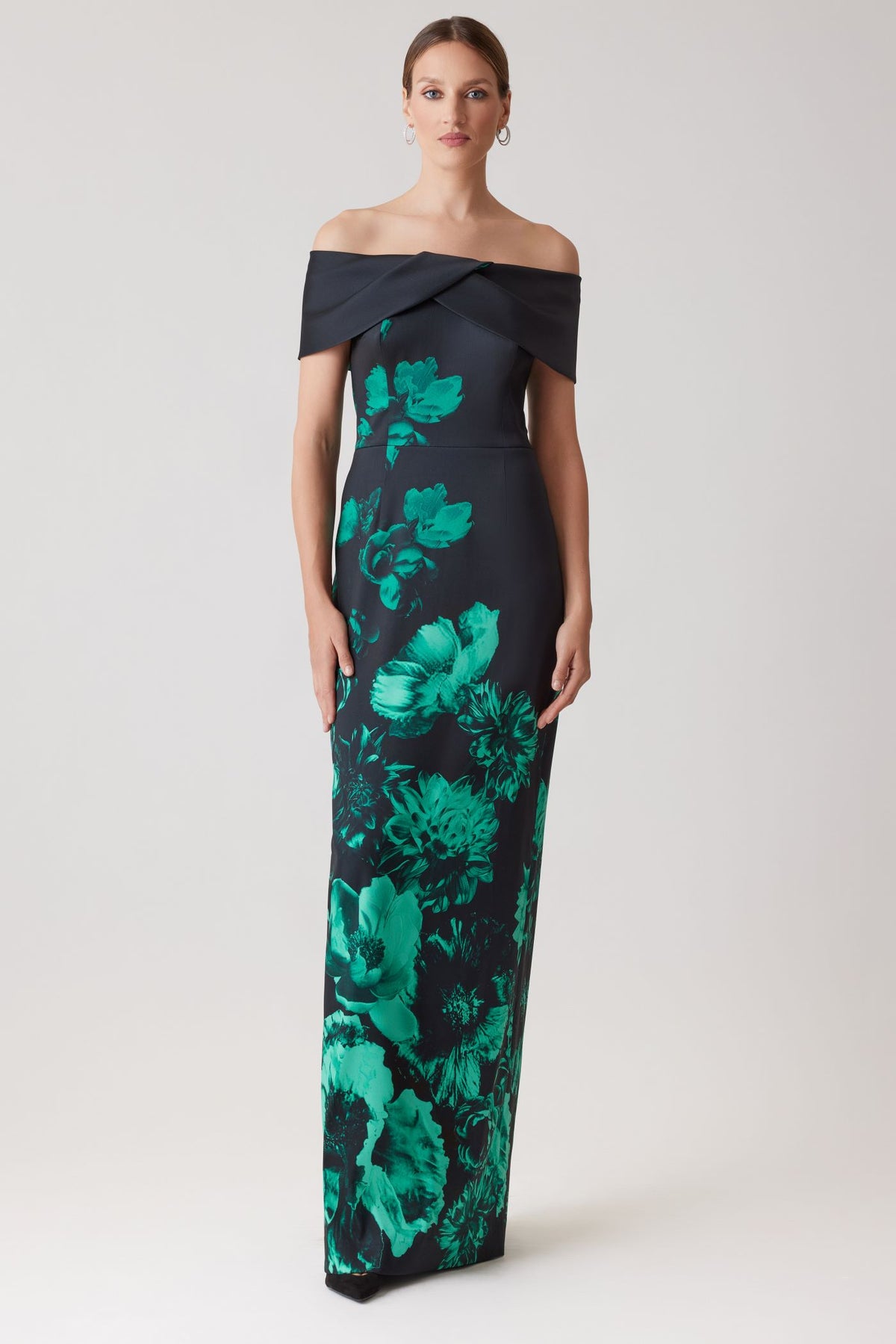 Model wearing Teri Jon 257008 off-the-shoulder column gown with bold floral print, ideal for formal evenings and mother of the bride or groom occasions.