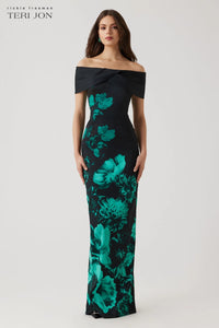 Model wearing Teri Jon 257008 off-the-shoulder column gown with bold floral print, ideal for formal evenings and mother of the bride or groom occasions.