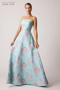 Teri Jon 259019 strapless gown with a scalloped neckline, metallic floral design, fitted bodice, and full A-line skirt.