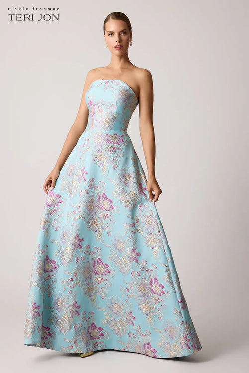 Teri Jon 259019 strapless gown with a scalloped neckline, metallic floral design, fitted bodice, and full A-line skirt.